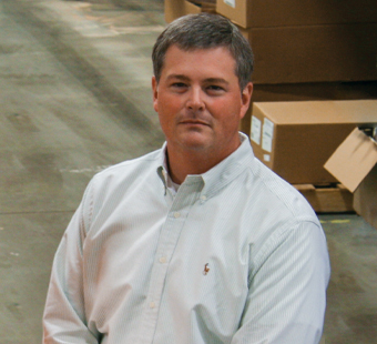 Mark Williams standing on the factory floor.