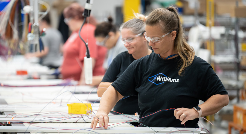 A group of H.E. Williams, Inc. employees working diligently on our quickship line